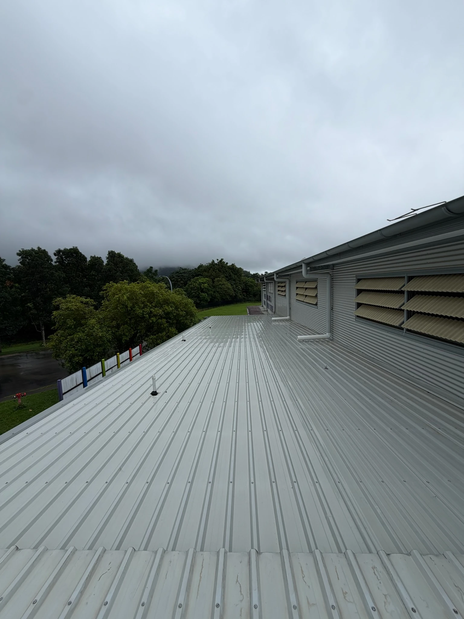 An exterior wall and cladding washed down ahead of painting